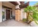 Inviting front entrance with a bench, plants, and a wreath on the door at 11 Knob Oak Dr, Henderson, NV 89052