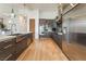 Bright modern kitchen features stainless steel appliances, custom cabinetry, and a large island at 11 Knob Oak Dr, Henderson, NV 89052