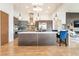 Modern kitchen with stainless appliances, custom cabinetry, island breakfast bar, and stylish pendant lighting at 11 Knob Oak Dr, Henderson, NV 89052