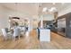 Bright open kitchen with stainless steel appliances, breakfast bar, and dining area at 11 Knob Oak Dr, Henderson, NV 89052