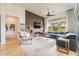 Modern living room showcasing a large sectional sofa, fireplace, and elegant decor at 11 Knob Oak Dr, Henderson, NV 89052