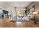 Spacious living room with sliding glass doors, modern decor, and open floor plan at 11 Knob Oak Dr, Henderson, NV 89052