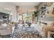 Bright living room with modern furnishings, wood floors, and an open floor plan at 11 Knob Oak Dr, Henderson, NV 89052