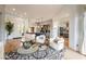 Bright and spacious living area with modern furnishings, wood floors, and an open floor plan at 11 Knob Oak Dr, Henderson, NV 89052
