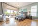 Bedroom features chandelier, access to backyard, hardwood floors, and ensuite at 11 Knob Oak Dr, Henderson, NV 89052