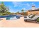 Inviting pool and spa with lounge chairs, perfect for relaxation and entertaining at 11 Knob Oak Dr, Henderson, NV 89052