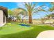 Lush backyard featuring a private putting green and landscaping, perfect for outdoor activities at 11 Knob Oak Dr, Henderson, NV 89052