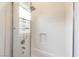 Modern shower featuring seamless glass, handheld wand, rainfall showerhead, and a built-in storage nook at 11 Knob Oak Dr, Henderson, NV 89052