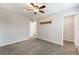 Spacious bedroom with neutral walls, a ceiling fan, and a large closet at 1102 E Dorrell Ln, North Las Vegas, NV 89086