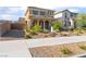 Charming two-story home featuring a covered front porch and desert landscaping, 'for sale' sign at 1102 E Dorrell Ln, North Las Vegas, NV 89086
