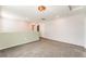Large loft area with neutral walls, carpet flooring, and recessed lighting at 1102 E Dorrell Ln, North Las Vegas, NV 89086