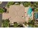 Aerial view showcasing the home, pool, spa, landscaped yard, and surrounding neighborhood at 11056 Kilkerran Ct, Las Vegas, NV 89141