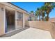 Balcony with views of palm trees and home interior with sliding glass door at 11056 Kilkerran Ct, Las Vegas, NV 89141