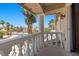 Charming balcony with decorative white railings and a view of the peaceful neighborhood at 11056 Kilkerran Ct, Las Vegas, NV 89141