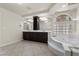 Well-lit bathroom with double vanity, soaking tub, and elegant tile flooring at 11056 Kilkerran Ct, Las Vegas, NV 89141