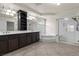 Spacious bathroom featuring a double vanity, separate shower, and a luxurious soaking tub at 11056 Kilkerran Ct, Las Vegas, NV 89141