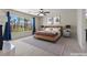 Bright bedroom with large windows offering natural light and views of the palms outside at 11056 Kilkerran Ct, Las Vegas, NV 89141