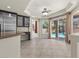 Sunny dining area, with sliding glass doors overlooking the pool and palm trees at 11056 Kilkerran Ct, Las Vegas, NV 89141