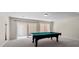 Game room with a pool table and sliding glass door at 11056 Kilkerran Ct, Las Vegas, NV 89141