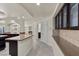 Hallway featuring tile floors, granite countertops, and dark wood cabinets at 11056 Kilkerran Ct, Las Vegas, NV 89141
