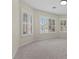 Bright, neutral living room featuring shuttered windows offering ample natural light at 11056 Kilkerran Ct, Las Vegas, NV 89141