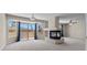 Bright living room with statement fireplace, large windows, and access to outdoor space at 11056 Kilkerran Ct, Las Vegas, NV 89141