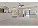 Wide living room shot with seamless transition to dining and game room areas at 11056 Kilkerran Ct, Las Vegas, NV 89141