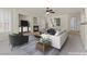 Open living room with fireplace, neutral decor, and comfortable seating arrangement at 11056 Kilkerran Ct, Las Vegas, NV 89141