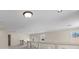 Spacious open loft area with views of the surrounding neighborhood through arched windows at 11056 Kilkerran Ct, Las Vegas, NV 89141