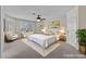 Staged main bedroom featuring plantation shutters, carpet and ceiling fan at 11056 Kilkerran Ct, Las Vegas, NV 89141