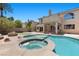 Backyard view of an in-ground pool with spa and tanning shelf at 11056 Kilkerran Ct, Las Vegas, NV 89141