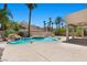 Gorgeous swimming pool with rock waterfall features, a built-in spa, and spacious patio at 11056 Kilkerran Ct, Las Vegas, NV 89141