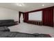 Theater room with plush seating and large projection screen at 11056 Kilkerran Ct, Las Vegas, NV 89141