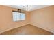 Bedroom with wood-look floors, ceiling fan with light, and window with blinds at 111 Narcissus Ln, Las Vegas, NV 89107