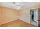 Bedroom features wood-look floors, ceiling fan, and ensuite bath at 111 Narcissus Ln, Las Vegas, NV 89107