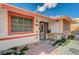 Well-kept home with a charming entrance, tidy landscaping, and a secure gate, offering curb appeal at 111 Narcissus Ln, Las Vegas, NV 89107