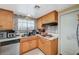 Wood cabinets and a tile backsplash are prominent features of this cozy kitchen at 111 Narcissus Ln, Las Vegas, NV 89107