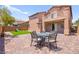 Landscaped backyard featuring a patio set, artificial turf, and a slide at 11274 Civita St, Las Vegas, NV 89141