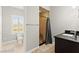 Bathroom featuring modern vanity, tile floors, and a glass-enclosed shower at 11274 Civita St, Las Vegas, NV 89141