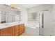 Bright bathroom featuring double vanity, soaking tub and glass-enclosed shower at 11274 Civita St, Las Vegas, NV 89141