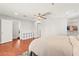Spacious bedroom with hardwood floors, a ceiling fan, and a walk-in closet at 11274 Civita St, Las Vegas, NV 89141