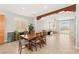 Bright dining room area featuring a wood dining table, tile floors, and natural light at 11274 Civita St, Las Vegas, NV 89141