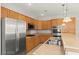 Well-equipped kitchen with stainless steel appliances and granite countertops at 11274 Civita St, Las Vegas, NV 89141
