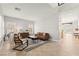 Open concept living room with tile floors, plantation shutters, and modern decor at 11274 Civita St, Las Vegas, NV 89141