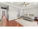 Bright main bedroom with hardwood floors, ceiling fan, and natural light at 11274 Civita St, Las Vegas, NV 89141