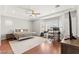 Main bedroom with ensuite office and a bed with neutral color bedding at 11274 Civita St, Las Vegas, NV 89141