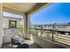 Relaxing balcony showcasing a cozy seating area and expansive views of the neighborhood at 11402 Ethereal Landing Ave, Las Vegas, NV 89138