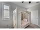 Elegant bedroom showcases a lovely canopy bed with an upholstered headboard and soft lighting at 11402 Ethereal Landing Ave, Las Vegas, NV 89138