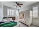 This spacious bedroom features a stylish four-poster bed and a ceiling fan for added comfort at 11402 Ethereal Landing Ave, Las Vegas, NV 89138