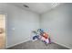 Neutral room with bright light, soft carpet and a book shelf for storage at 11402 Ethereal Landing Ave, Las Vegas, NV 89138